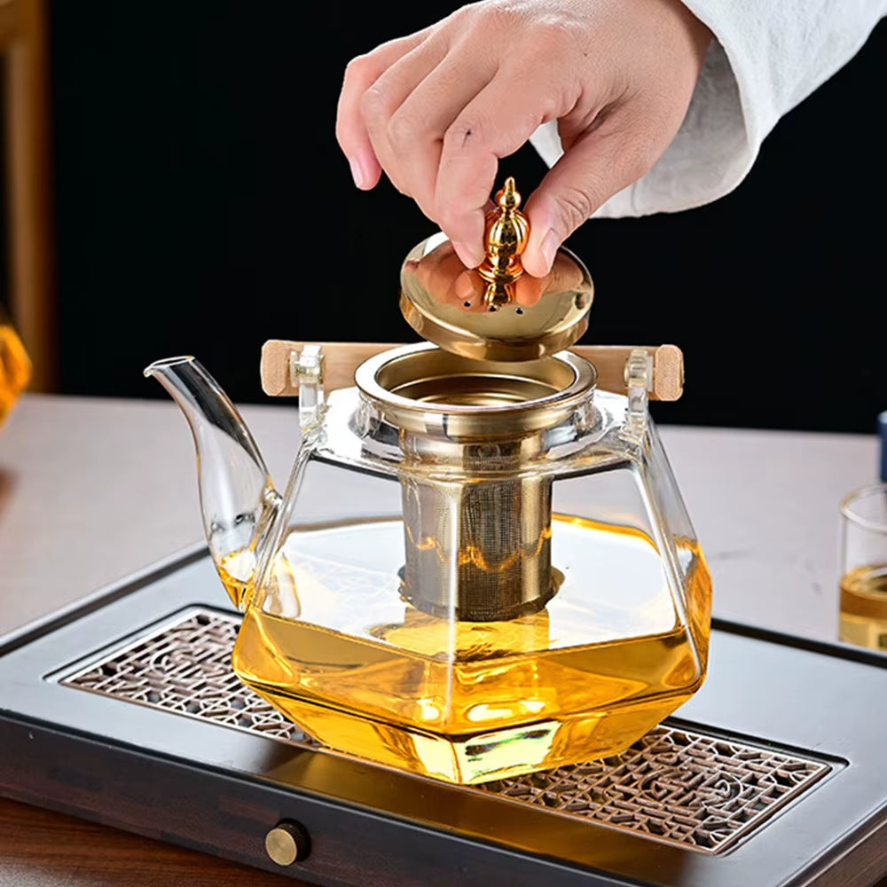 Tetera de vidrio resistente al calor con forma de diamante, con infusor extraíble.
