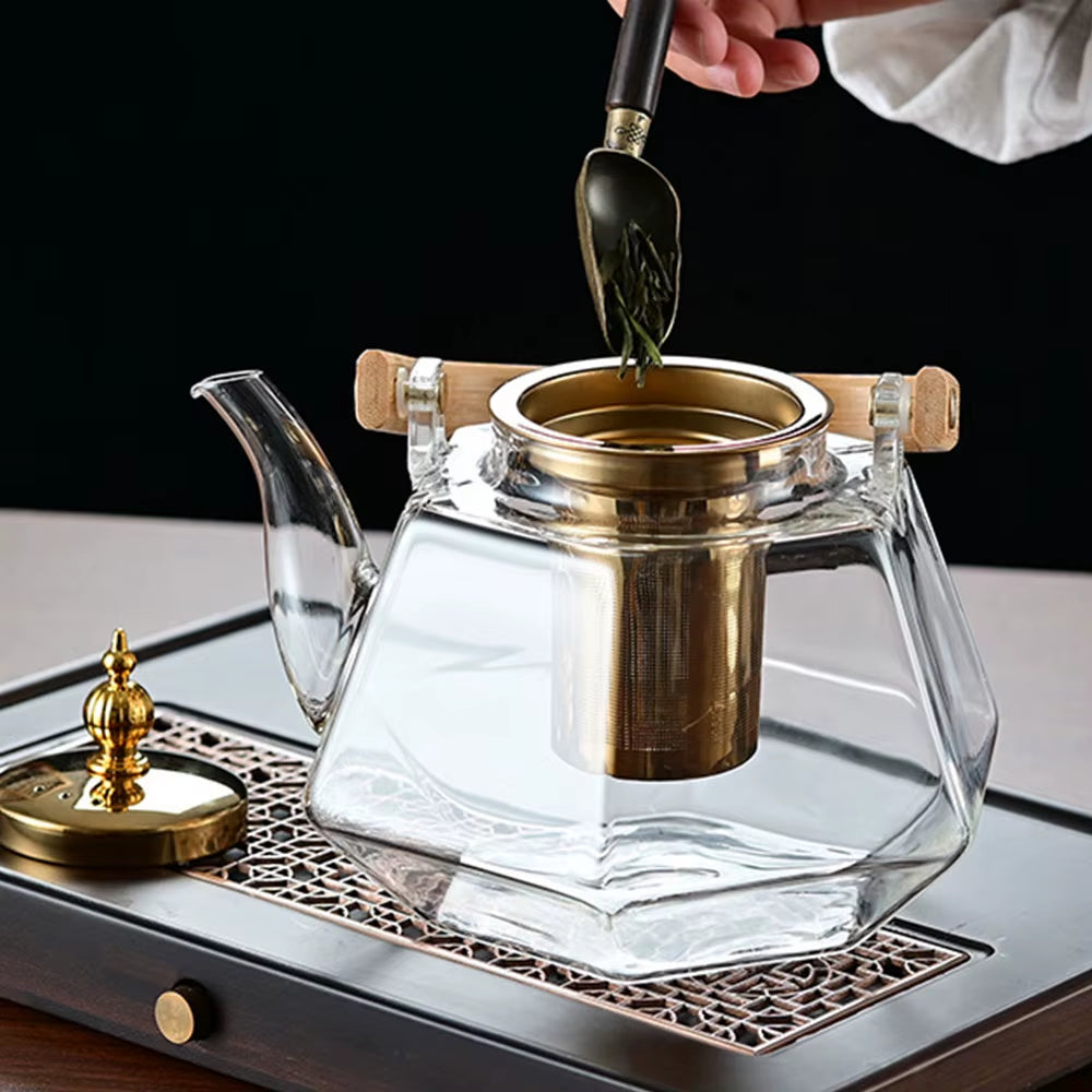 Tetera de vidrio resistente al calor con forma de diamante, con infusor extraíble.